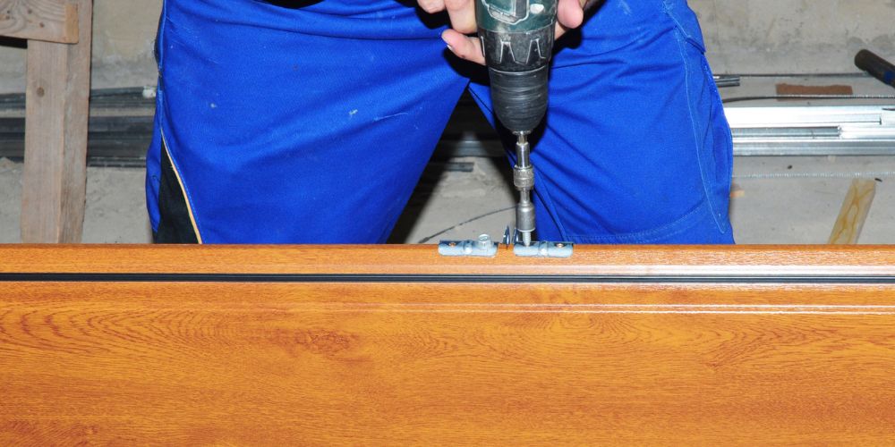 Technician performing safe garage door repair