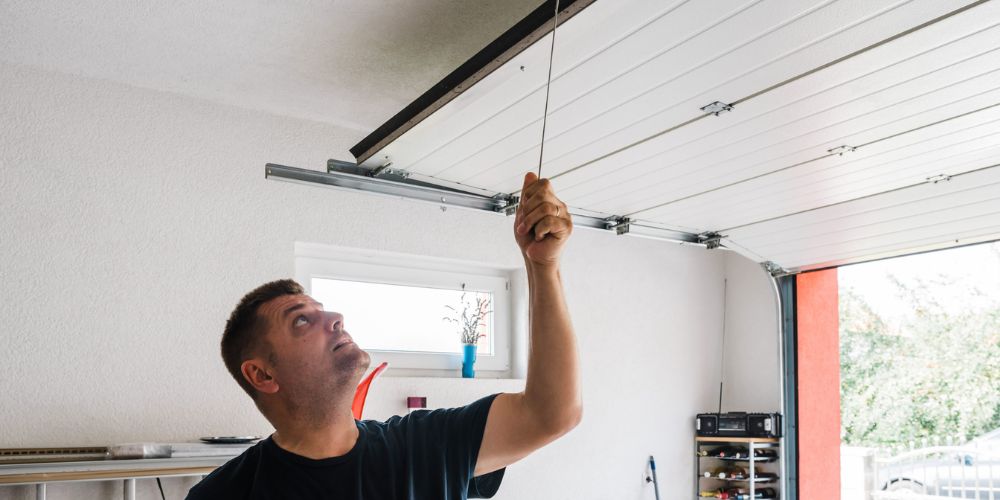Inspection of a commercial garage door for repair needs