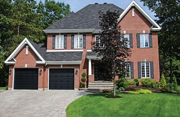 Black Garage Doors on Red Brick